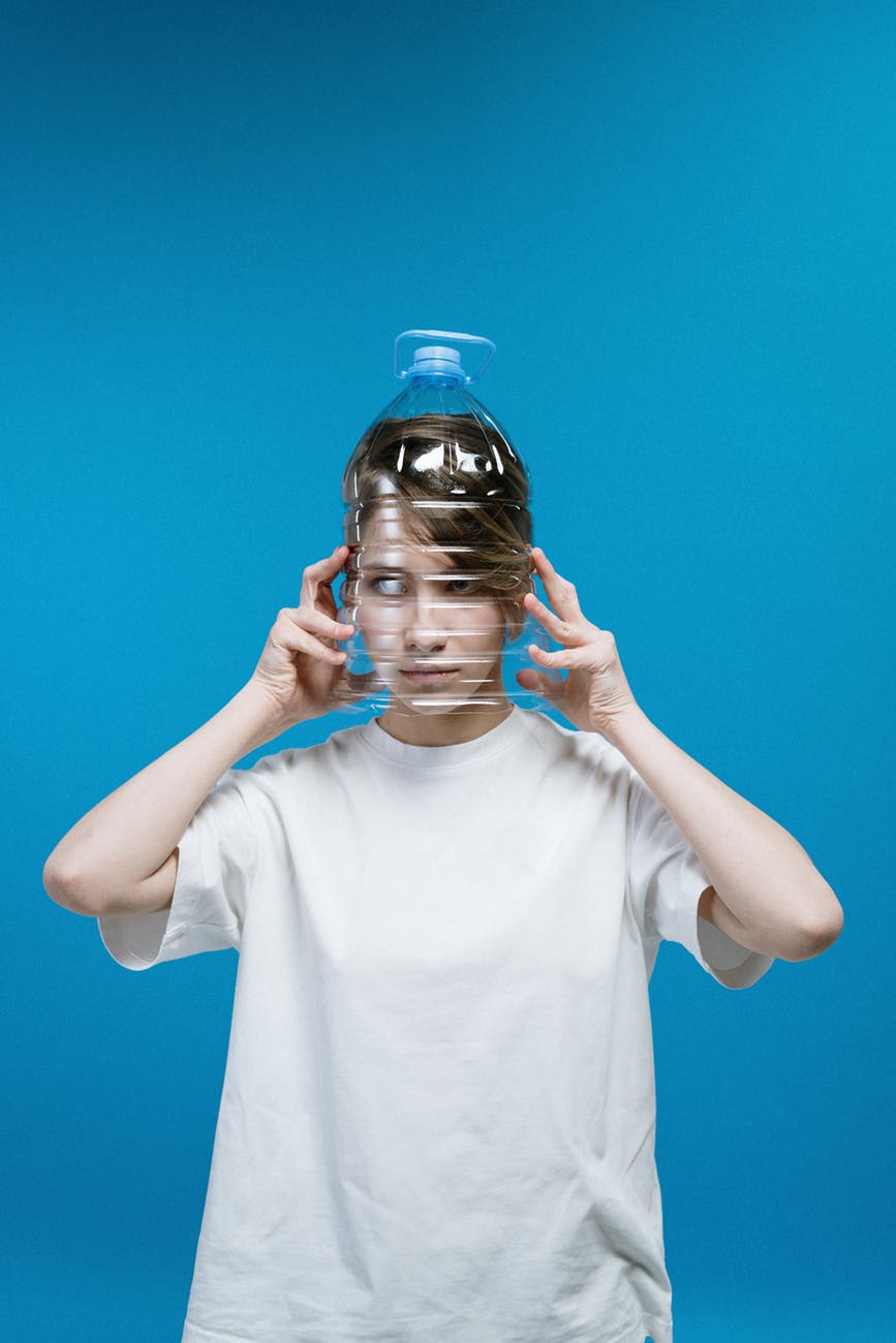 woman wearing plastic bottle on head